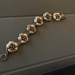Beautiful flowers bracelet with toggle chain , has matching necklace 925